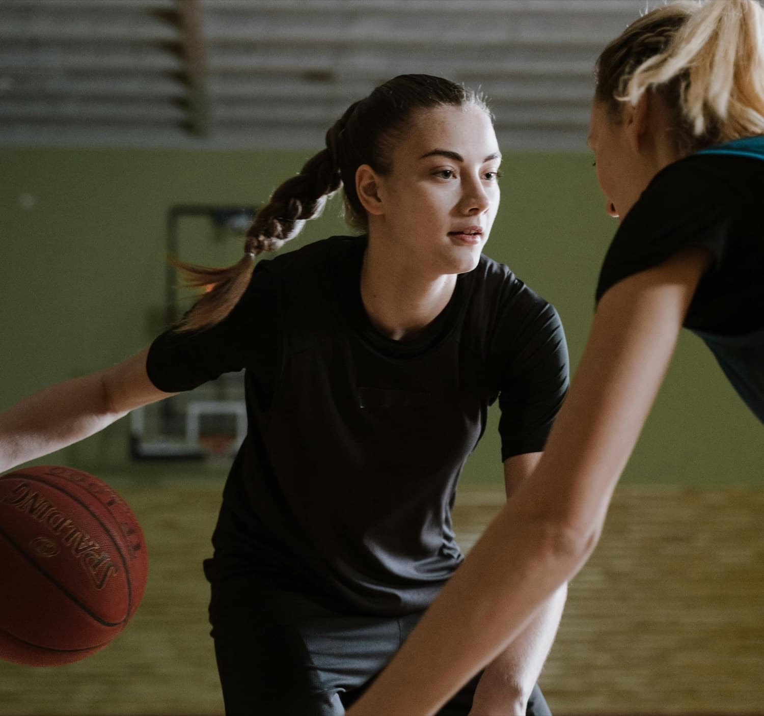 A woman playing basketball, energetic and active, reflecting restored daily energy after addressing root-cause fatigue