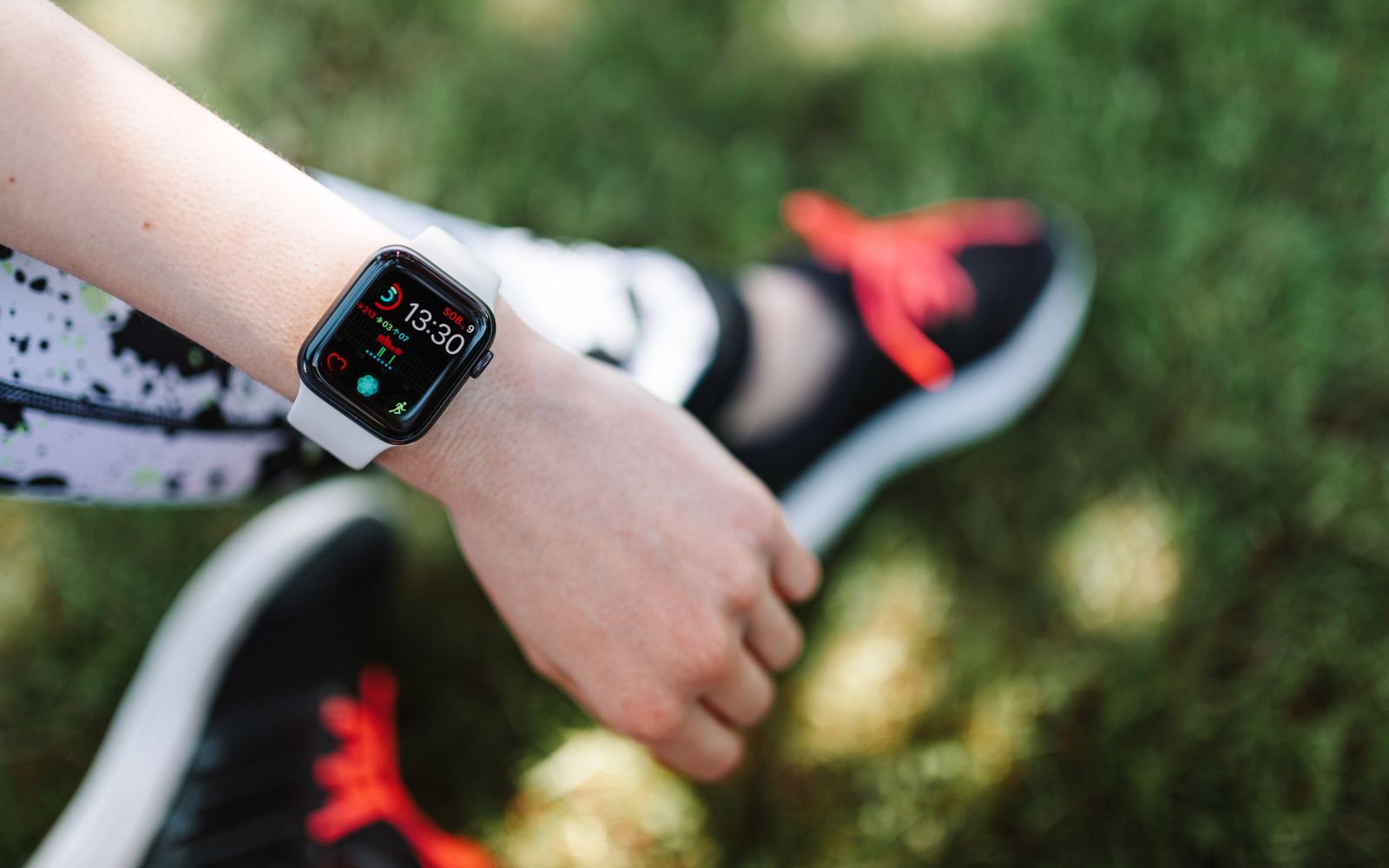 A person checking the step count on a fitness tracker watch